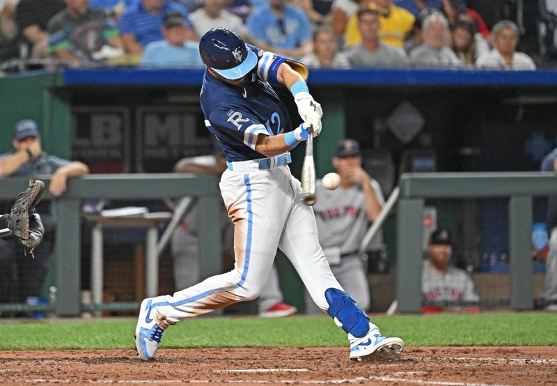 Sep 1, 2023; Kansas City, Missouri, USA;  Kansas City Royals designated hitter Nick Loftin (12) hits an RBI double for his first Major League hit in the third inning against the Boston Red Sox at Kauffman Stadium. Mandatory Credit: Peter Aiken-USA TODAY Sports