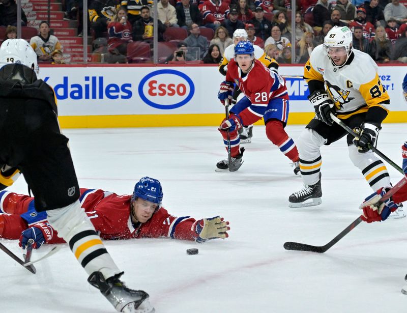 Oct 14, 2024; Montreal, Quebec, CAN; Montreal Canadiens defenseman Kaiden Guhle (21) attempts to block a pass to Pittsburgh Penguins forward Sidney Crosby (87) during the first period at the Bell Centre. Mandatory Credit: Eric Bolte-Imagn Images