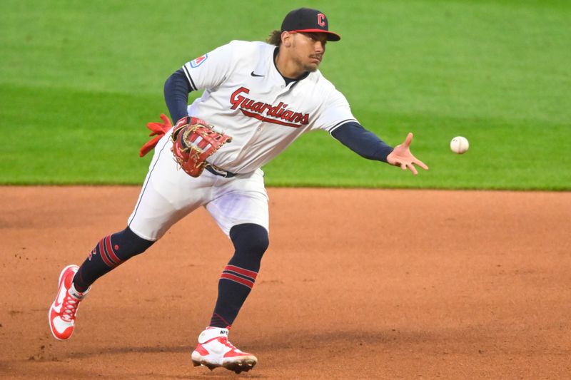 Apr 13, 2024; Cleveland, Ohio, USA; Cleveland Guardians first baseman Josh Naylor (22) tosses the ball to first base in the seventh inning against the New York Yankees at Progressive Field. Mandatory Credit: David Richard-USA TODAY Sports