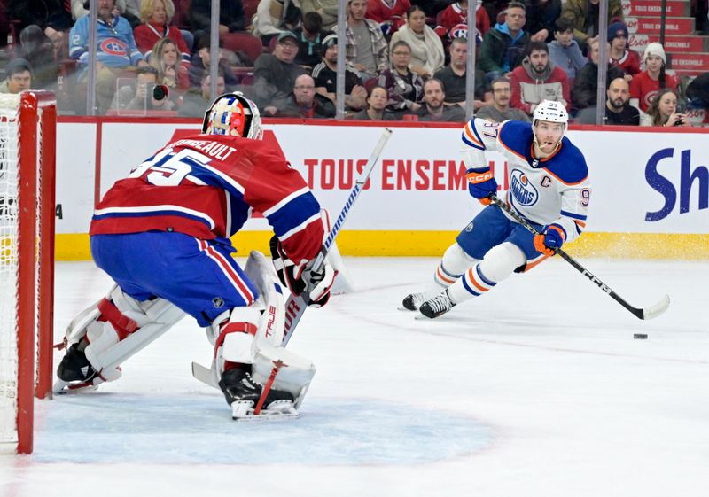 Jan 13, 2024; Montreal, Quebec, CAN; Edmonton Oilers forward Connor McDavid (97) plays the puck and Montreal Canadiens goalie Sam Montembeault (35) defends during the first period at the Bell Centre. Mandatory Credit: Eric Bolte-USA TODAY Sports