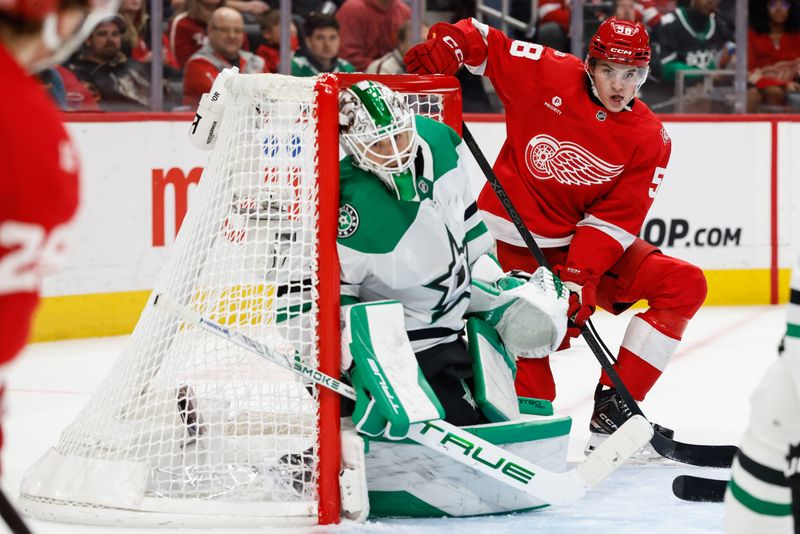 Dec 23, 2025; Detroit, Michigan, USA;  Detroit Red Wings center Emmitt Finnie (58) looks for a pass in front of Dallas Stars goaltender Casey Desmith (1) in the second period at Little Caesars Arena. Mandatory Credit: Rick Osentoski-Imagn Images