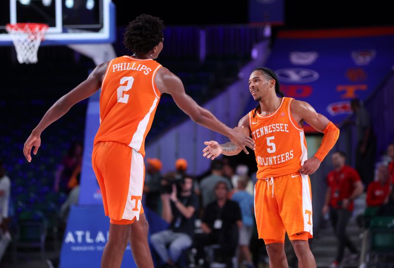 Nov 24, 2022; Paradise Island, BAHAMAS; Tennessee Volunteers forward Julian Phillips (2) celebrates with Tennessee Volunteers guard Zakai Zeigler (5) in overtime against the USC Trojans at Imperial Arena. Mandatory Credit: Kevin Jairaj-USA TODAY Sports