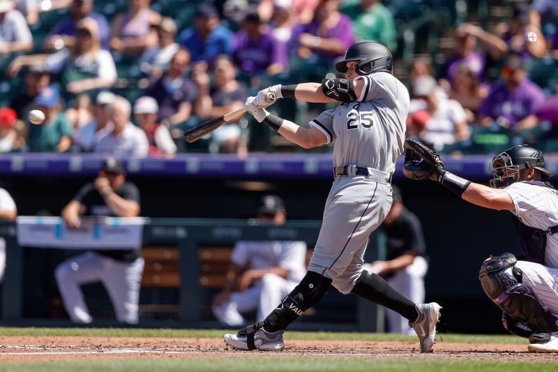 Aug 20, 2023; Denver, Colorado, USA; Chicago White Sox designated hitter Andrew Vaughn (25) hits a single in the third inning against the Colorado Rockies at Coors Field. Mandatory Credit: Isaiah J. Downing-USA TODAY Sports