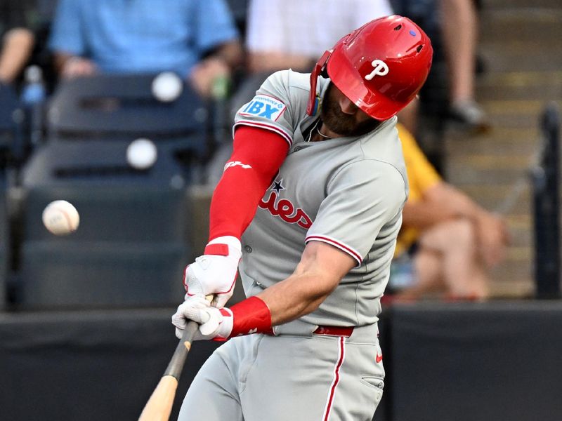May 8, 2025; St. Petersburg, Florida, USA;  Philadelphia Phillies first baseman Bryce Harper (3) hits a sacrifice fly ball  in the first inning against the Tampa Bay Rays at George M. Steinbrenner Field. Mandatory Credit: Jonathan Dyer-Imagn Images