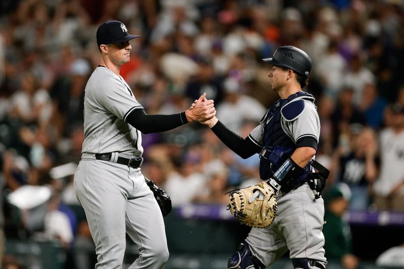 Jul 15, 2023; Denver, Colorado, USA; New York Yankees relief pitcher Clay Holmes (35) celebrates with catcher Kyle Higashioka (66) after the game against the Colorado Rockies at Coors Field. Mandatory Credit: Isaiah J. Downing-USA TODAY Sports