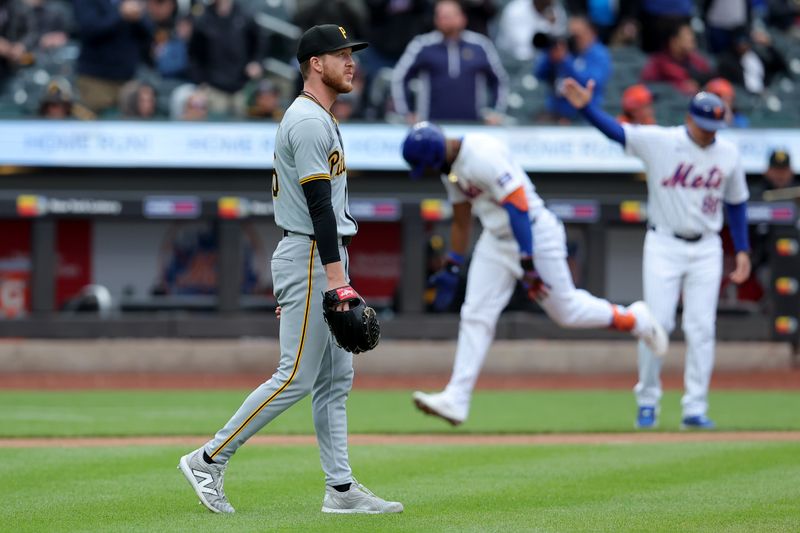 Apr 17, 2024; New York City, New York, USA; Pittsburgh Pirates starting pitcher Bailey Falter (26) reacts after a two run home run by New York Mets designated hitter Starling Marte (6) during the third inning at Citi Field. Mandatory Credit: Brad Penner-USA TODAY Sports