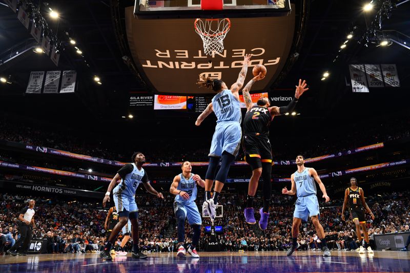 PHOENIX, AZ - FEBRUARY 11:  Nick Richards #2 of the Phoenix Suns drives to the basket during the game against the Memphis Grizzlies on February 11, 2025 at Footprint Center in Phoenix, Arizona. NOTE TO USER: User expressly acknowledges and agrees that, by downloading and or using this photograph, user is consenting to the terms and conditions of the Getty Images License Agreement. Mandatory Copyright Notice: Copyright 2025 NBAE (Photo by Barry Gossage/NBAE via Getty Images)