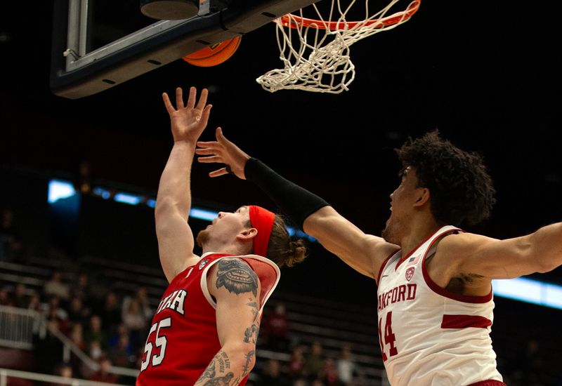 Jan 14, 2024; Stanford, California, USA; Utah Utes guard Gabe Madsen (55) lays up the ball ahead of Stanford Cardinal forward Spencer Jones (14) during the first half at Maples Pavilion. Mandatory Credit: D. Ross Cameron-USA TODAY Sports