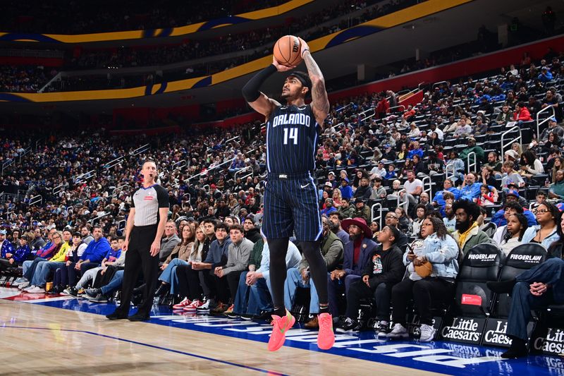 DETROIT, MI - JANUARY 1:  Gary Harris #14 of the Orlando Magic shoots a three point basket during the game against the Detroit Pistons on January 1, 2025 at Little Caesars Arena in Detroit, Michigan. NOTE TO USER: User expressly acknowledges and agrees that, by downloading and/or using this photograph, User is consenting to the terms and conditions of the Getty Images License Agreement. Mandatory Copyright Notice: Copyright 2025 NBAE (Photo by Chris Schwegler/NBAE via Getty Images)