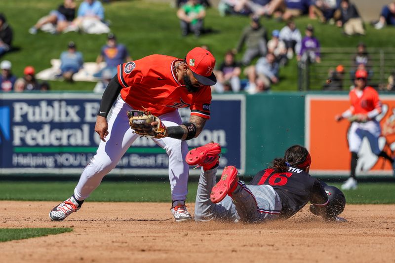 Feb 23, 2026; Lakeland, Florida, USA; Minnesota Twins center fielder Austin Martin (16) steals second base in front of Detroit Tigers second baseman Gleyber Torres (25) during the third inning  at Publix Field at Joker Marchant Stadium. Mandatory Credit: Mike Watters-Imagn Images