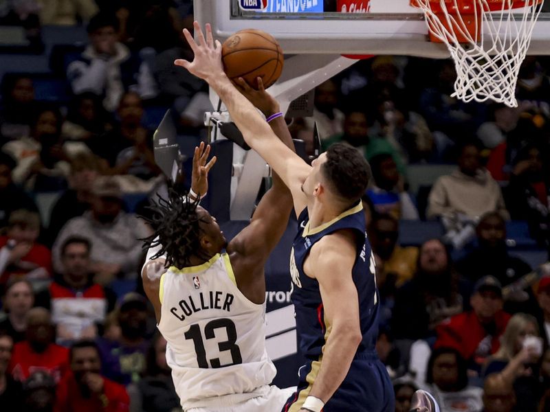 NEW ORLEANS, LOUISIANA - JANUARY 17: Karlo Matkovic #17 of the New Orleans Pelicans blocks a shot by Isaiah Collier #13 of the Utah Jazz during the first half of a game at the Smoothie King Center on January 17, 2025 in New Orleans, Louisiana. NOTE TO USER: User expressly acknowledges and agrees that, by downloading and or using this photograph, User is consenting to the terms and conditions of the Getty Images License Agreement. (Photo by Derick E. Hingle/Getty Images)