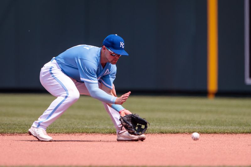 Jun 4, 2023; Kansas City, Missouri, USA; Kansas City Royals second baseman Michael Massey (19) reaches for a ground ball during the seventh inning against the Colorado Rockies at Kauffman Stadium. Mandatory Credit: William Purnell-USA TODAY Sports