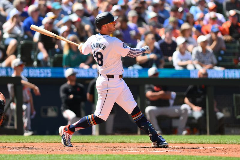 Jul 4, 2024; Seattle, Washington, USA; Seattle Mariners designated hitter Mitch Garver (18) hits a home run against the Baltimore Orioles during the seventh inning at T-Mobile Park. Mandatory Credit: Steven Bisig-USA TODAY Sports