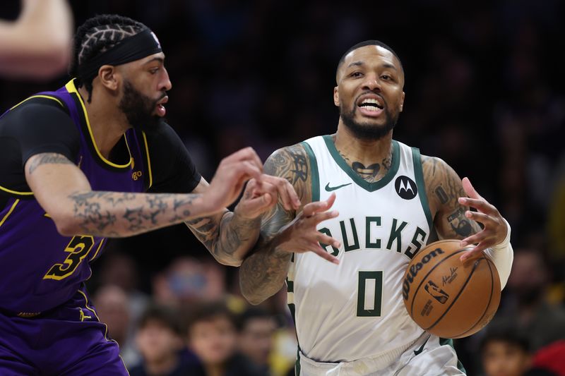 LOS ANGELES, CALIFORNIA - MARCH 08: Anthony Davis #3 of the Los Angeles Lakers strips the ball from Damian Lillard #0 of the Milwaukee Bucks during the first half of a game at Crypto.com Arena on March 08, 2024 in Los Angeles, California. (Photo by Sean M. Haffey/Getty Images)