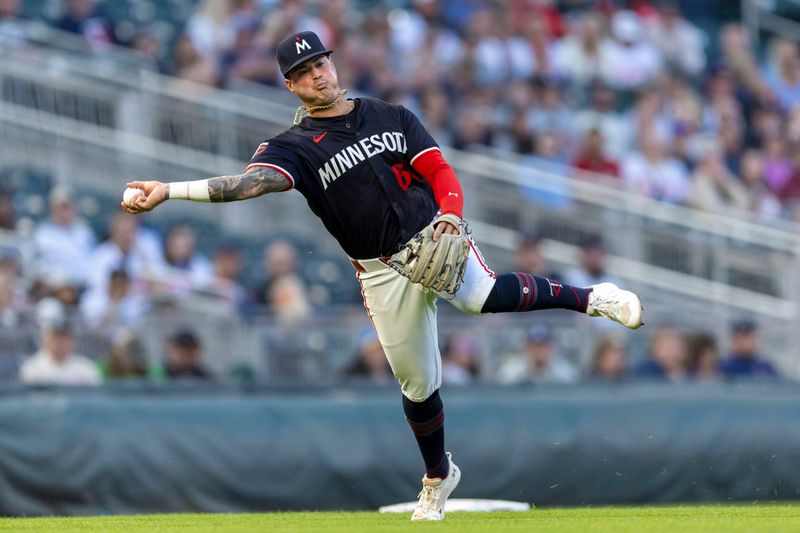 May 14, 2024; Minneapolis, Minnesota, USA; Minnesota Twins third baseman Jose Miranda (64) throws the ball to first base against the New York Yankees in the fifth inning at Target Field. Mandatory Credit: Jesse Johnson-USA TODAY Sports