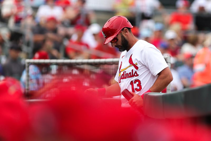 Mar 1, 2024; Jupiter, Florida, USA; St. Louis Cardinals designated hitter Matt Carpenter (13) returns to the dugout after striking out against the New York Mets during the third inning at Roger Dean Chevrolet Stadium. Mandatory Credit: Sam Navarro-USA TODAY Sports