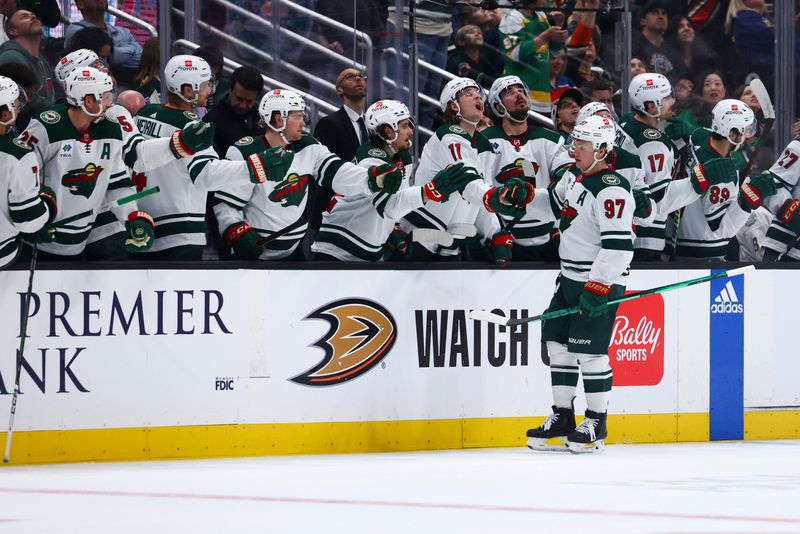 Mar 19, 2024; Anaheim, California, USA; Minnesota Wild left wing Kirill Kaprizov (97) celebrates with his teammates after scoring a goal against the Anaheim Ducks during the second period of a game at Honda Center. Mandatory Credit: Jessica Alcheh-USA TODAY Sports