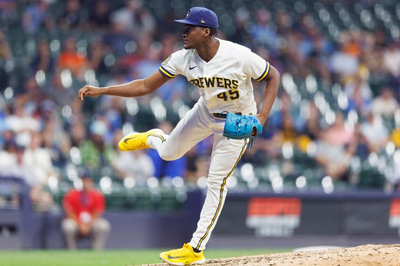 Aug 8, 2023; Milwaukee, Wisconsin, USA;  Milwaukee Brewers pitcher Abner Uribe (45) throws a pitch during the tenth inning against the Colorado Rockies at American Family Field. Mandatory Credit: Jeff Hanisch-USA TODAY Sports