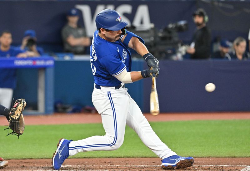 Aug 26, 2023; Toronto, Ontario, CAN;  Toronto Blue Jays second baseman Davis Schneider (36) hits a double against the Cleveland Guardians in the fourth inning at Rogers Centre. Mandatory Credit: Dan Hamilton-USA TODAY Sports