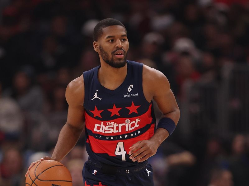 CHICAGO, ILLINOIS - JANUARY 10: Jared Butler #4 of the Washington Wizards dribbles up the court against the Chicago Bulls during the first half at the United Center on January 10, 2025 in Chicago, Illinois. NOTE TO USER: User expressly acknowledges and agrees that, by downloading and or using this photograph, User is consenting to the terms and conditions of the Getty Images License Agreement.  (Photo by Michael Reaves/Getty Images)
