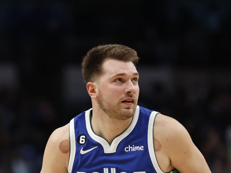 DALLAS, TEXAS - DECEMBER 27:  Luka Doncic #77 of the Dallas Mavericks dribbles the ball against the New York Knicks in the second half at American Airlines Center on December 27, 2022 in Dallas, Texas. NOTE TO USER: User expressly acknowledges and agrees that, by downloading and or using this photograph, User is consenting to the terms and conditions of the Getty Images License Agreement.  (Photo by Tim Heitman/Getty Images)