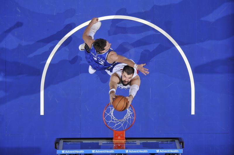 ORLANDO, FL - MARCH 29: Ivica Zubac #40 of the LA Clippers dunks the ball during the game against the Orlando Magic on March 29, 2024 at the Kia Center in Orlando, Florida. NOTE TO USER: User expressly acknowledges and agrees that, by downloading and or using this photograph, User is consenting to the terms and conditions of the Getty Images License Agreement. Mandatory Copyright Notice: Copyright 2024 NBAE (Photo by Fernando Medina/NBAE via Getty Images)