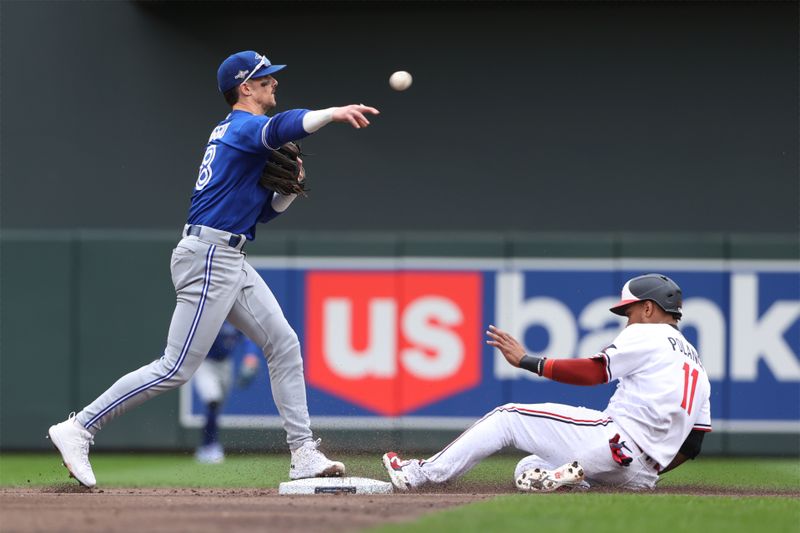 Oct 4, 2023; Minneapolis, Minnesota, USA; Toronto Blue Jays second baseman Cavan Biggio (8) forces out Minnesota Twins second baseman Jorge Polanco (11) in the first inning during game two of the Wildcard series for the 2023 MLB playoffs at Target Field. Mandatory Credit: Jesse Johnson-USA TODAY Sports