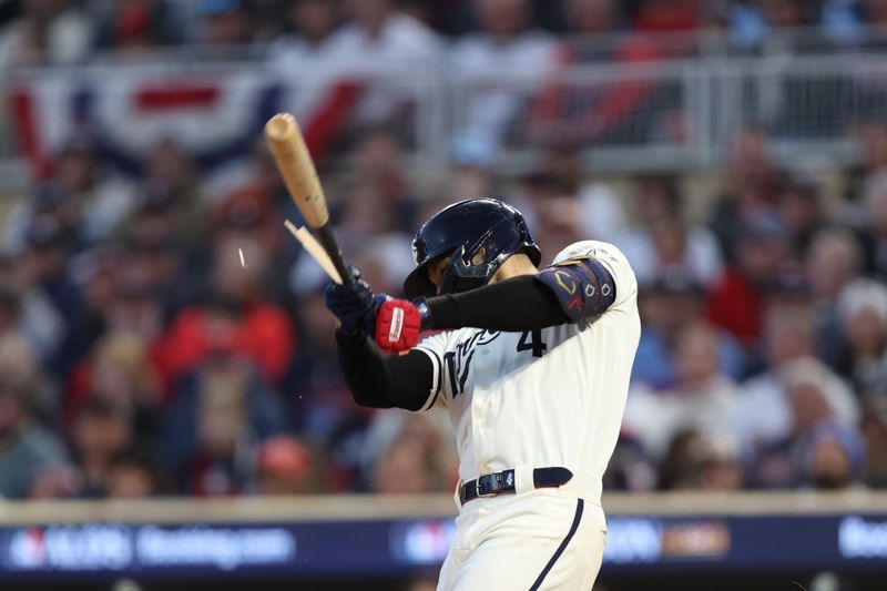 Oct 11, 2023; Minneapolis, Minnesota, USA;Minnesota Twins shortstop Carlos Correa (4) breaks his bat in the second inning against the Houston Astros during game four of the ALDS for the 2023 MLB playoffs at Target Field. Mandatory Credit: Jesse Johnson-USA TODAY Sports