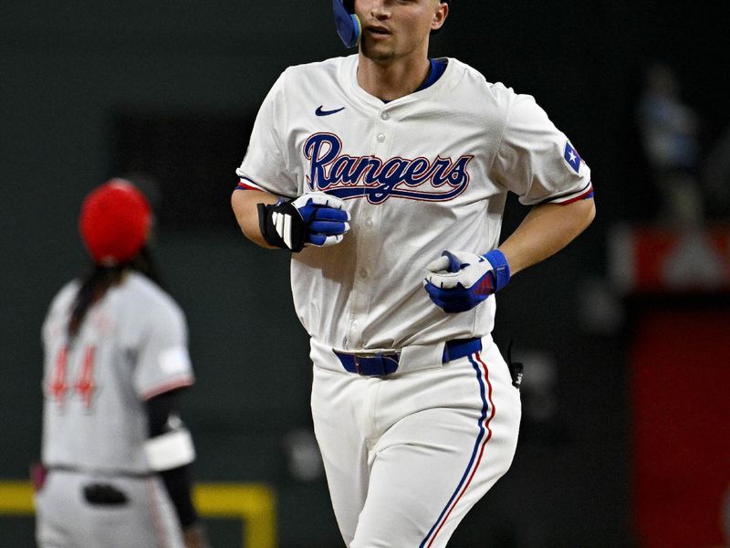 Apr 27, 2024; Arlington, Texas, USA; Texas Rangers shortstop Corey Seager (5) rounds the bases after he hits a home run against the Cincinnati Reds during the ninth inning at Globe Life Field. Mandatory Credit: Jerome Miron-USA TODAY Sports