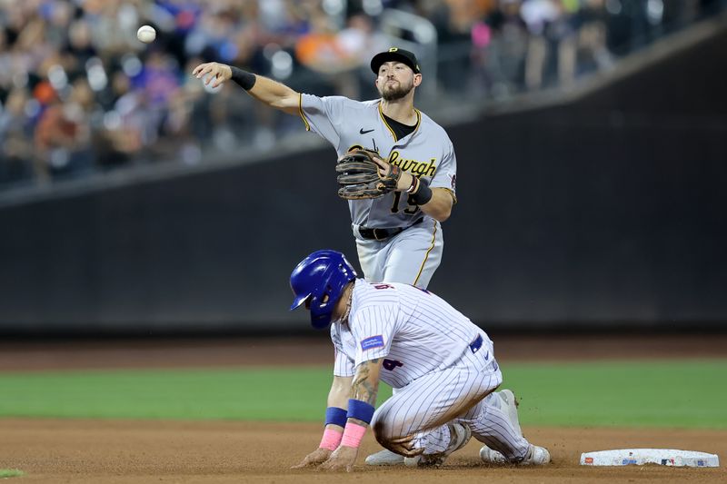 Aug 15, 2023; New York City, New York, USA; Pittsburgh Pirates second baseman Jared Triolo (19) forces out New York Mets catcher Francisco Alvarez (4) at second base and throws to first to complete a double play on a ball hit by Mets designated hitter Mark Vientos (not pictured) during the fourth inning at Citi Field. Mandatory Credit: Brad Penner-USA TODAY Sports