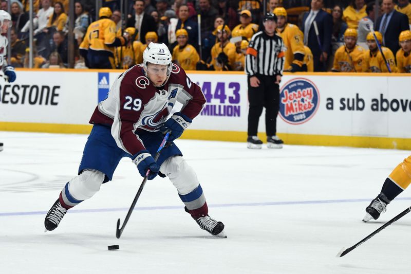 Mar 2, 2024; Nashville, Tennessee, USA; Colorado Avalanche center Nathan MacKinnon (29) skates the puck into the offensive zone during the second period against the Nashville Predators at Bridgestone Arena. Mandatory Credit: Christopher Hanewinckel-USA TODAY Sports