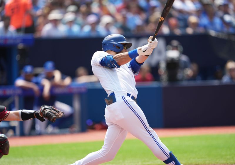 Jul 16, 2023; Toronto, Ontario, CAN; Toronto Blue Jays center fielder Kevin Kiermaier (39) hits a single against the Arizona Diamondbacks during the fifth inning at Rogers Centre. Mandatory Credit: Nick Turchiaro-USA TODAY Sports