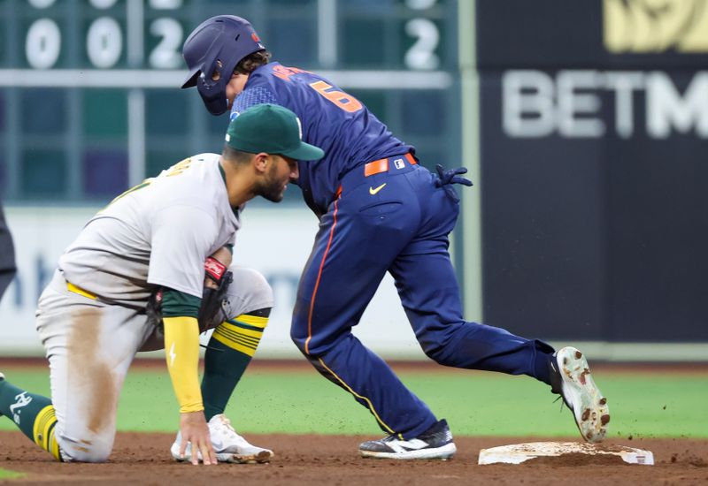 May 13, 2024; Houston, Texas, USA;Houston Astros center fielder Jake Meyers (6) steals third base against the Oakland Athletics on a throw in the seventh inning at Minute Maid Park. Mandatory Credit: Thomas Shea-USA TODAY Sports