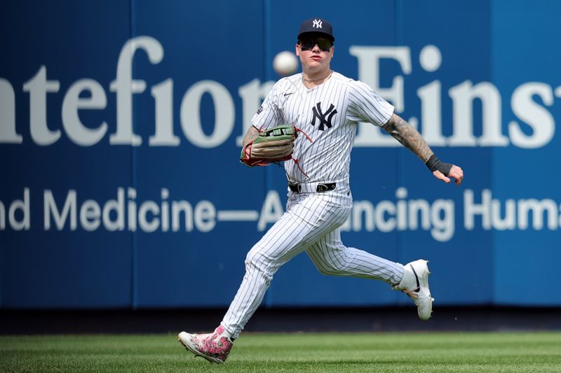 May 23, 2024; Bronx, New York, USA; New York Yankees left fielder Alex Verdugo (24) fields a single by Seattle Mariners second baseman Jorge Polanco (not pictured) during the ninth inning at Yankee Stadium. Mandatory Credit: Brad Penner-USA TODAY Sports