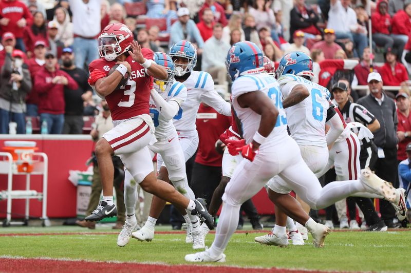 Nov 2, 2024; Fayetteville, Arkansas, USA; Arkansas Razorbacks quarterback Malchi Singleton (3) rushes for a touchdown in the third quarter against the Ole Miss Rebels at Donald W. Reynolds Razorback Stadium. Mississippi won 63-31. Mandatory Credit: Nelson Chenault-Imagn Images