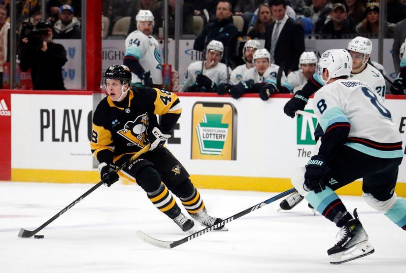 Jan 15, 2024; Pittsburgh, Pennsylvania, USA; Pittsburgh Penguins right wing Valtteri Puustinen (48) skates with the puck against the Seattle Kraken during the first period at PPG Paints Arena. Mandatory Credit: Charles LeClaire-USA TODAY Sports