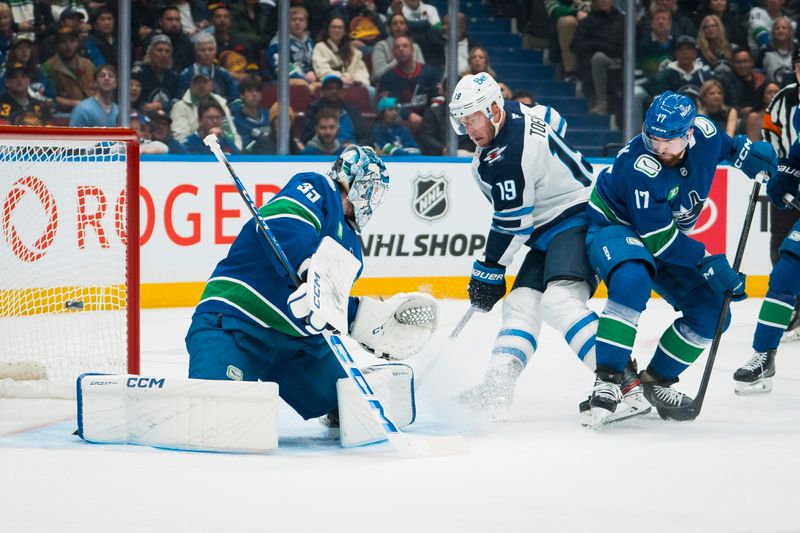 Nov 11, 2025; Vancouver, British Columbia, CAN; Vancouver Canucks defenseman Filip Hronek (17) watches as Winnipeg Jets forward Jonathan Toews (19) scores on goalie Thatcher Demko (35) in the first period at Rogers Arena. Mandatory Credit: Bob Frid-Imagn Images