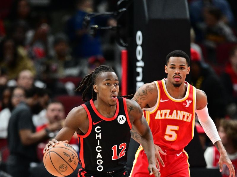 CHICAGO, IL - APRIL 1: Ayo Dosunmu #12 of the Chicago Bulls dribbles the ball during the game against the Atlanta Hawks on April 1, 2024 at United Center in Chicago, Illinois. NOTE TO USER: User expressly acknowledges and agrees that, by downloading and or using this photograph, User is consenting to the terms and conditions of the Getty Images License Agreement. Mandatory Copyright Notice: Copyright 2024 NBAE (Photo by Adam Hagy/NBAE via Getty Images)