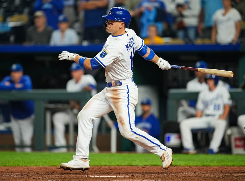 Aug 15, 2023; Kansas City, Missouri, USA; Kansas City Royals second baseman Michael Massey (19) hits an RBI single during the ninth inning against the Seattle Mariners at Kauffman Stadium. Mandatory Credit: Jay Biggerstaff-USA TODAY Sports