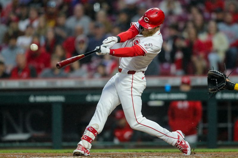 Apr 9, 2024; Cincinnati, Ohio, USA; Cincinnati Reds outfielder Jake Fraley (27) hits a RBI single in the fourth inning against the Milwaukee Brewers at Great American Ball Park. Mandatory Credit: Katie Stratman-USA TODAY Sports