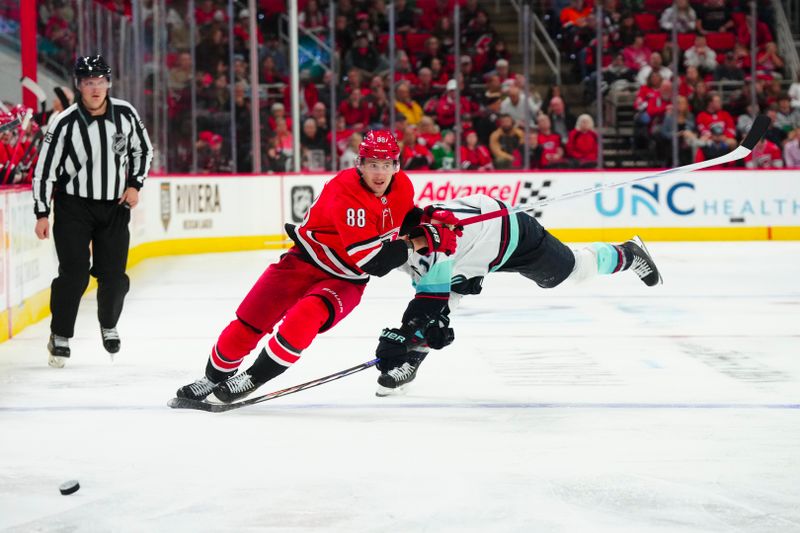 Oct 26, 2023; Raleigh, North Carolina, USA; Carolina Hurricanes center Martin Necas (88) skates after the puck against the Seattle Kraken during the third period at PNC Arena. Mandatory Credit: James Guillory-USA TODAY Sports