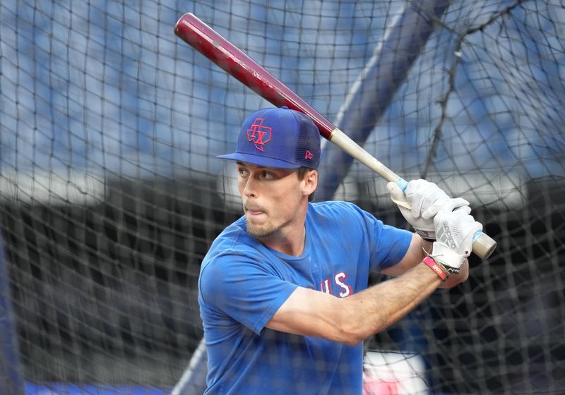 Sep 13, 2023; Toronto, Ontario, CAN; Texas Rangers center fielder Evan Carter (32) takes batting practice before a game against the Toronto Blue Jays at Rogers Centre. Mandatory Credit: Nick Turchiaro-USA TODAY Sports