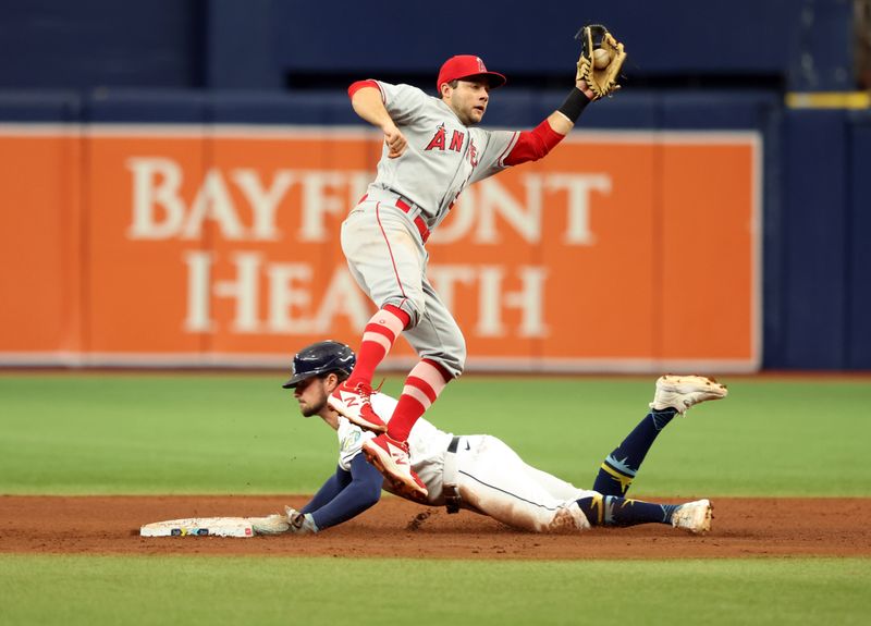 Sep 21, 2023; St. Petersburg, Florida, USA; Tampa Bay Rays right fielder Josh Lowe (15) steals second base as Los Angeles Angels shortstop David Fletcher (22) attempted to tag out during the sixth inning at Tropicana Field. Mandatory Credit: Kim Klement Neitzel-USA TODAY Sports