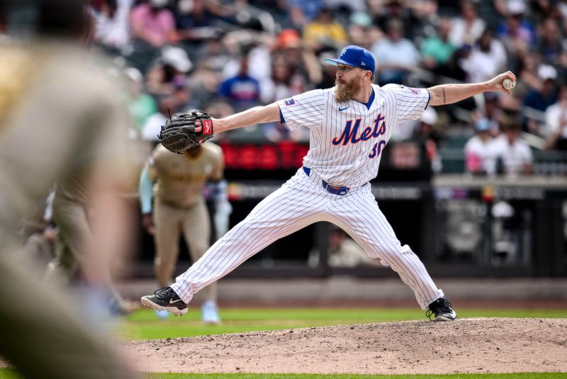 Jun 16, 2024; New York City, New York, USA; New York Mets pitcher Jake Diekman (30) pitches against the San Diego Padres during the eighth inning at Citi Field. Mandatory Credit: John Jones-USA TODAY Sports