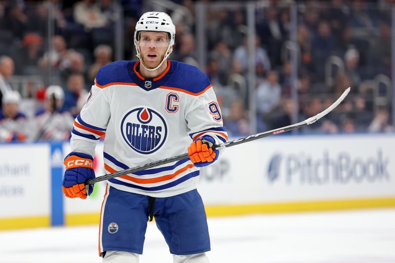 Dec 19, 2023; Elmont, New York, USA; Edmonton Oilers center Connor McDavid (97) skates against the New York Islanders during the first period at UBS Arena. Mandatory Credit: Brad Penner-USA TODAY Sports