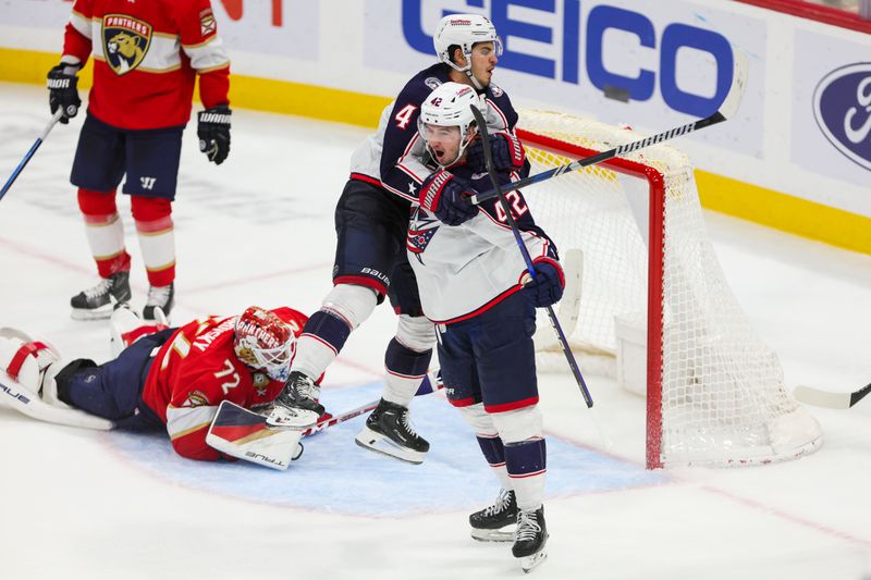 Nov 6, 2023; Sunrise, Florida, USA; Columbus Blue Jackets center Alexandre Texier (42) celebrates with center Cole Sillinger (4) after scoring against the Florida Panthers during the third period at Amerant Bank Arena. Mandatory Credit: Sam Navarro-USA TODAY Sports