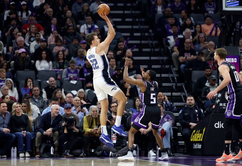 SACRAMENTO, CALIFORNIA - JANUARY 03: Franz Wagner #22 of the Orlando Magic shoots over De'Aaron Fox #5 of the Sacramento Kings during the first half of an NBA basketball game at Golden 1 Center on January 03, 2024 in Sacramento, California. NOTE TO USER: User expressly acknowledges and agrees that, by downloading and or using this photograph, User is consenting to the terms and conditions of the Getty Images License Agreement. (Photo by Thearon W. Henderson/Getty Images)