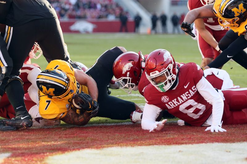 Nov 24, 2023; Fayetteville, Arkansas, USA; Missouri Tigers running back Cody Schrader (7) scores a touchdown during the first quarter against the Arkansas Razorbacks at Donald W. Reynolds Razorback Stadium. Mandatory Credit: Nelson Chenault-USA TODAY Sports