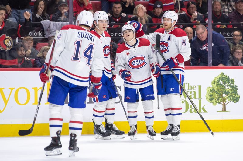 Apr 13, 2024; Ottawa, Ontario, CAN; Montreal Canadiens right wing Cole Caufield (22) celebrates with team his goal scored the second period against the Ottawa Senators at the Canadian Tire Centre. Mandatory Credit: Marc DesRosiers-USA TODAY Sports