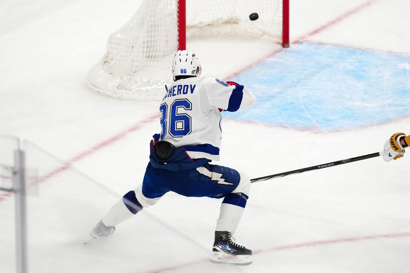 Mar 19, 2024; Las Vegas, Nevada, USA; Tampa Bay Lightning right wing Nikita Kucherov (86) scores an empty net goal against the Vegas Golden Knights during the third period at T-Mobile Arena. Mandatory Credit: Stephen R. Sylvanie-USA TODAY Sports